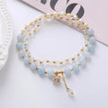 Women's double ring crystal bracelet in choice of strawberry quartz, amethyst, or aquamarine colour