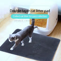 Black EVA foam cat litter pad with honeycomb design beside litter box