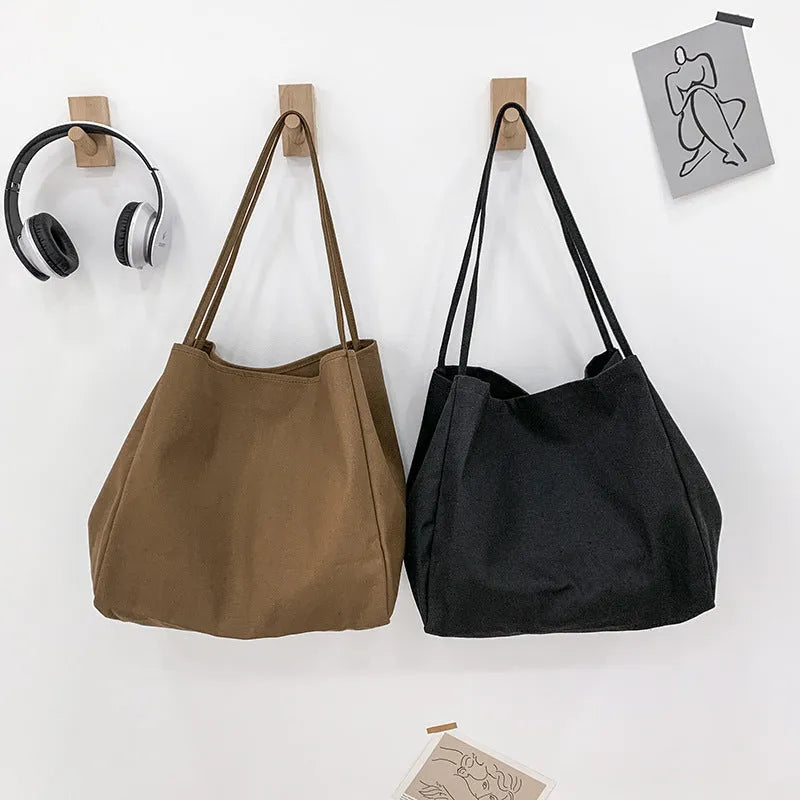 Solid colour canvas women's handbag with double shoulder straps and horizontal square shape