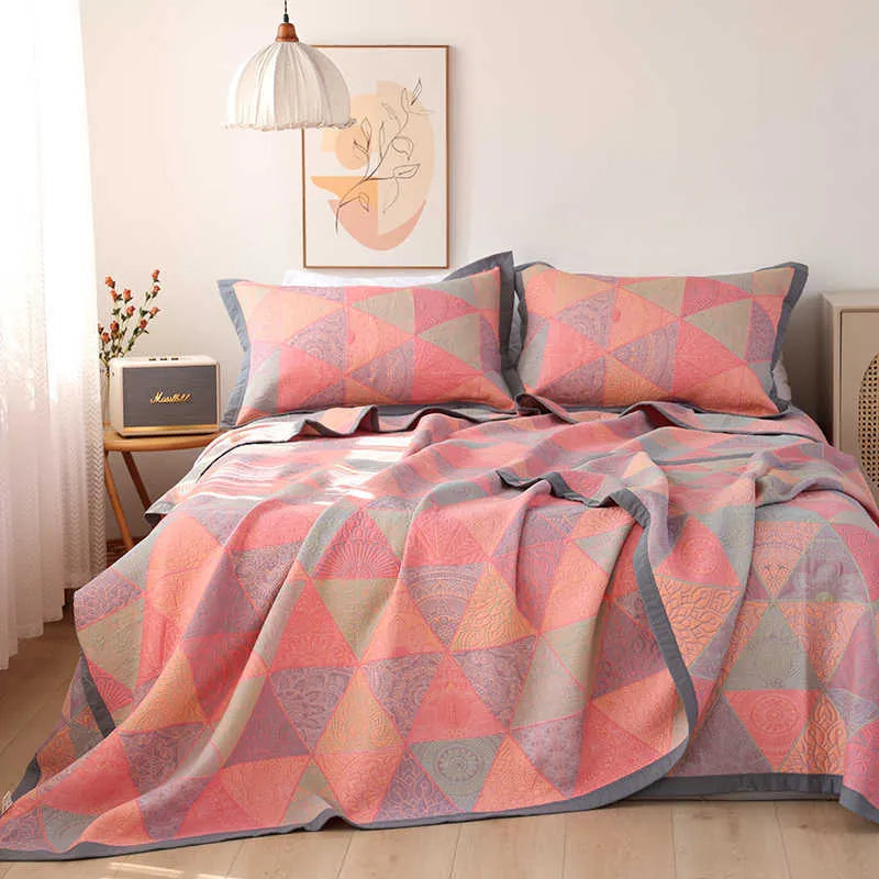 Three-piece cotton gauze bedding set with floral pattern showing blanket and two pillowcases