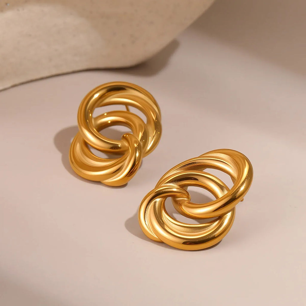 18K gold electroplated stainless steel geometric circle stud earrings on display