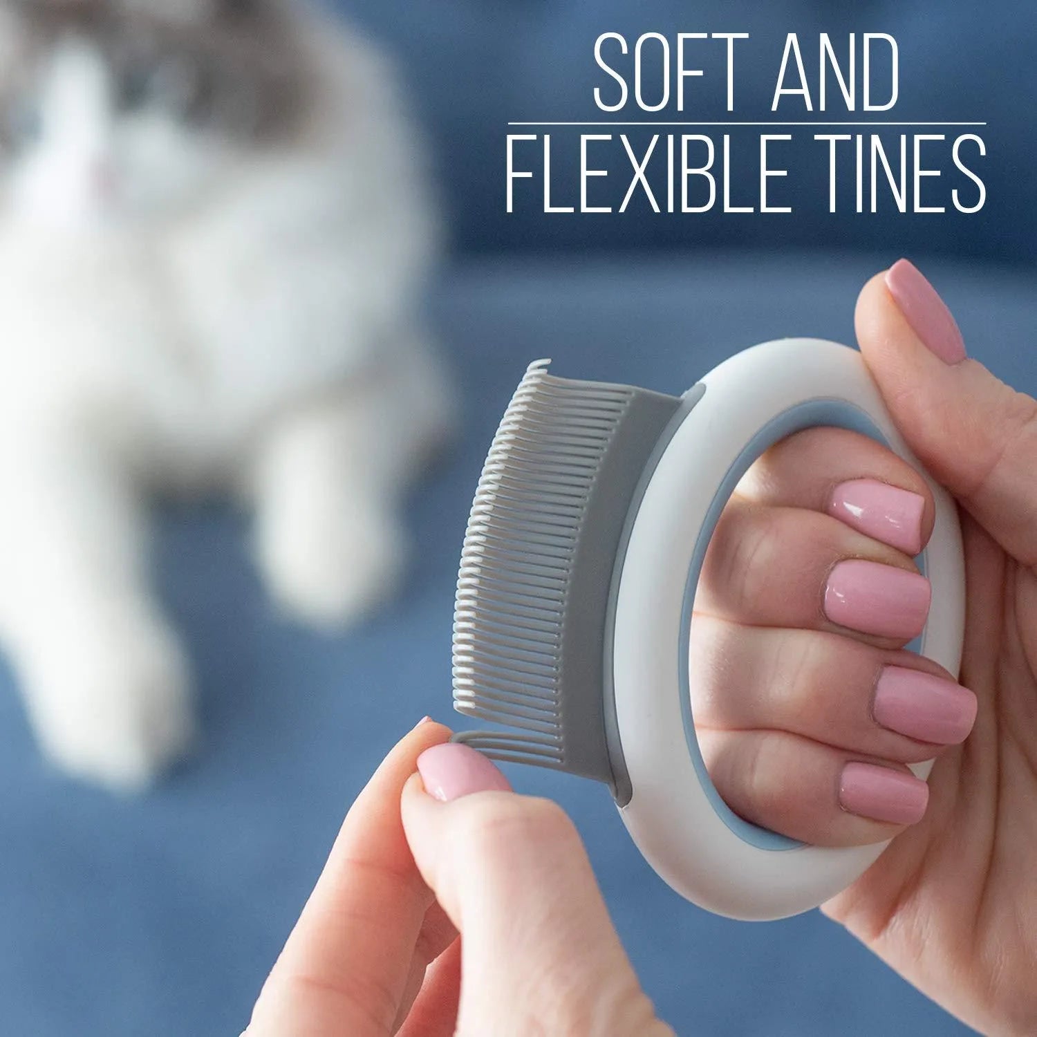 Blue plastic pet grooming comb for removing loose hair from cats and dogs on a white background.