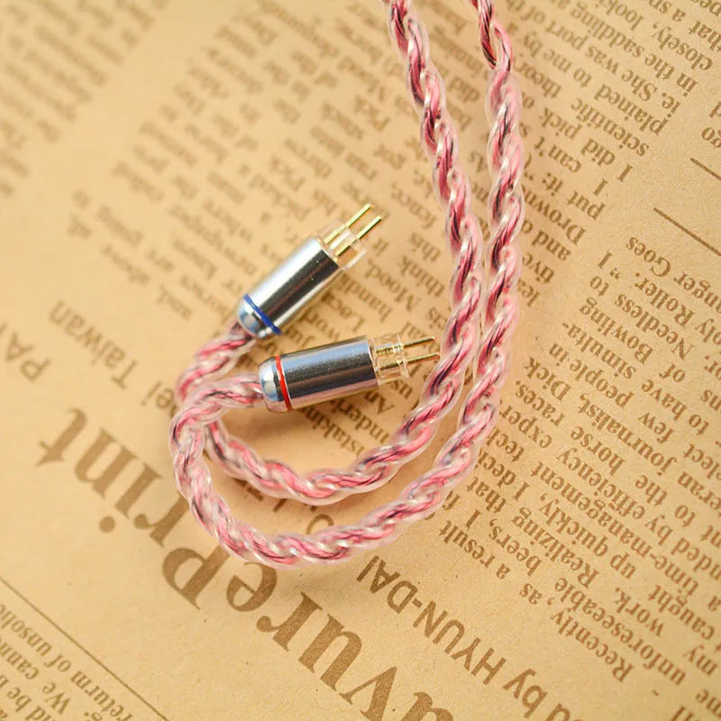 Black German pure copper headphone cable with 3.5mm angled plug and MMCX connectors on a light background