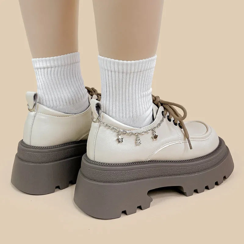 White women's Mary Jane platform shoes with chunky heel and front lace-up.
