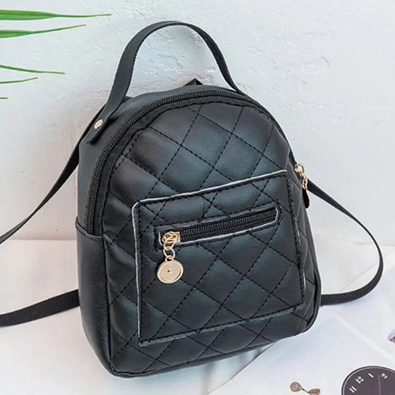 A white hard-shell girls backpack with embroidery, showing its square shape and soft top handle.