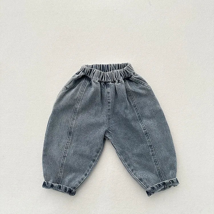 Light blue children's baggy denim jeans with elastic waistband, front view