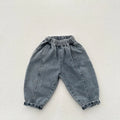 Light blue children's baggy denim jeans with elastic waistband, front view