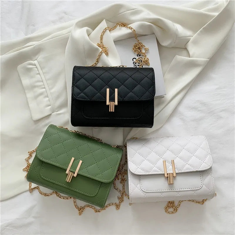 Women's minimalist crossbody bag with diamond lattice chain strap in black, green, or white.
