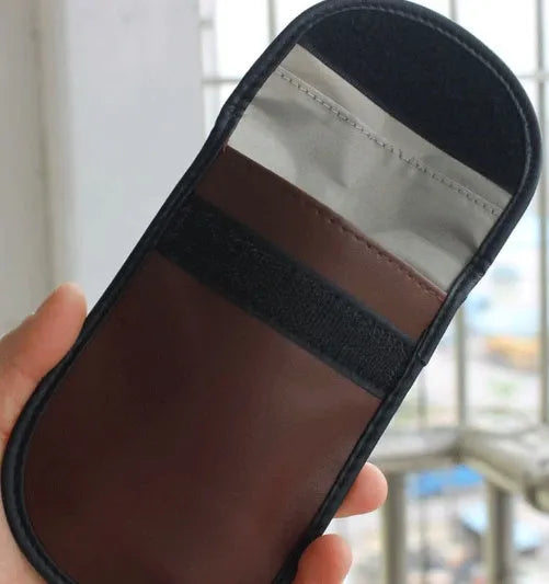 Black microfiber Faraday cage signal blocker bag for car key fobs and RFID cards.