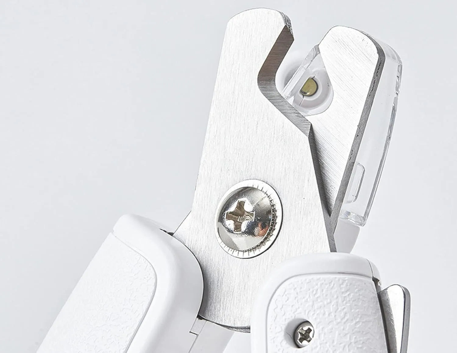 White pet nail clippers with LED light, transparent anti-splash guard, and triangular blade for cats and dogs