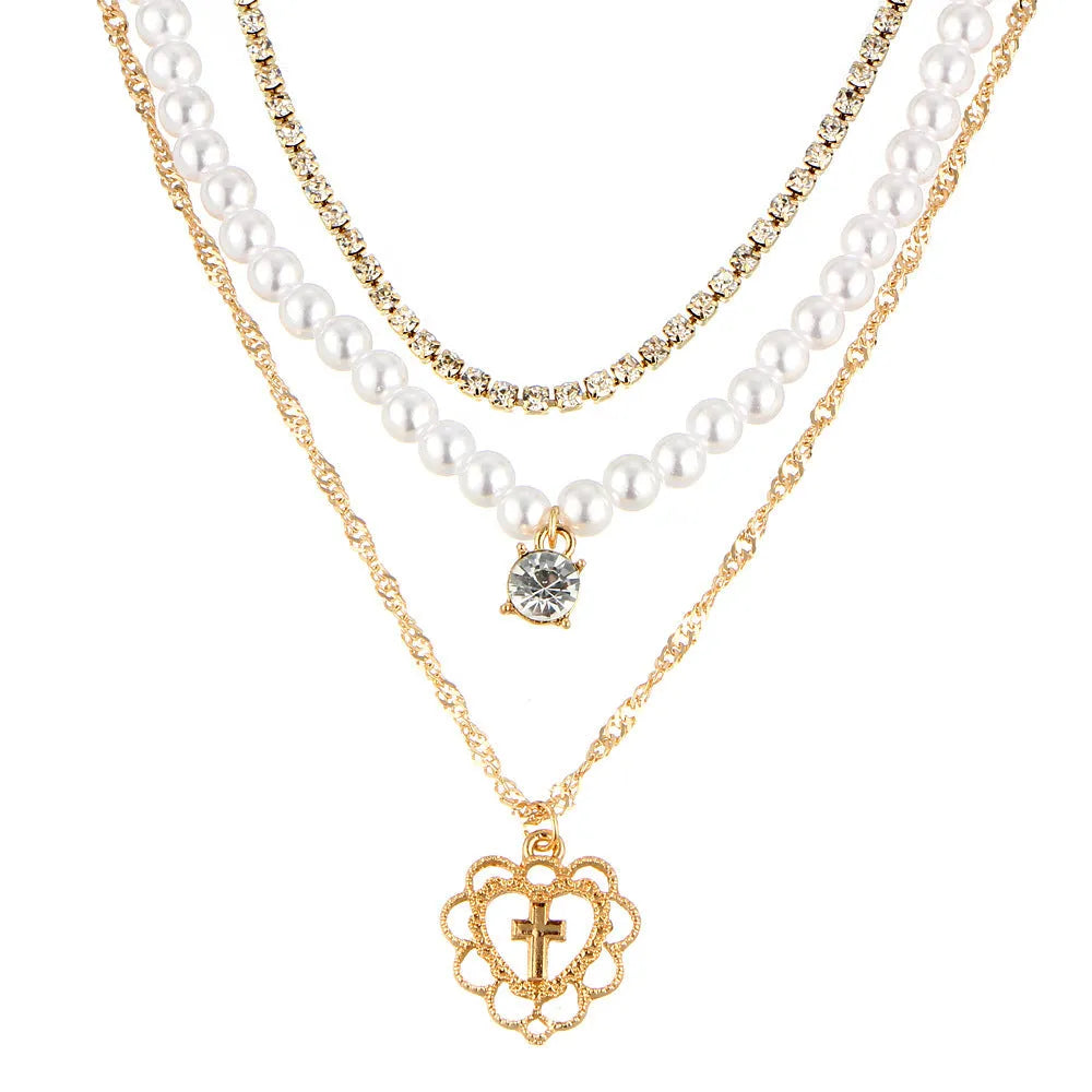 Gold multilayer necklace with heart motif, rhinestones and 6mm imitation pearls, 28-32-40cm chain plus 10cm extension