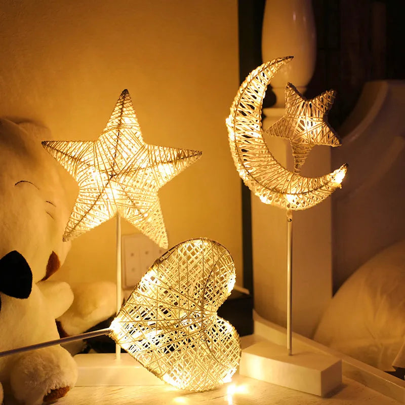 Rattan and copper wire LED table lamp in star, love heart, or moon shape for bedroom decoration.
