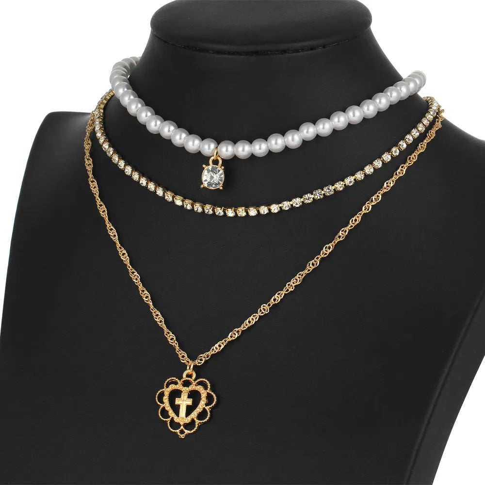 Gold multilayer necklace with heart motif, rhinestones and 6mm imitation pearls, 28-32-40cm chain plus 10cm extension