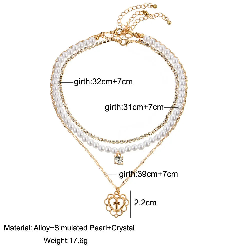Gold multilayer necklace with heart motif, rhinestones and 6mm imitation pearls, 28-32-40cm chain plus 10cm extension