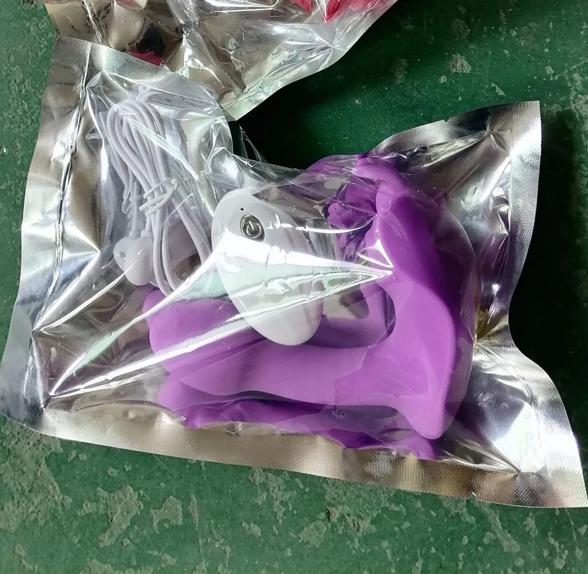 Remote control wearable butterfly silicone dildo in purple with aluminium storage bag and USB cable
