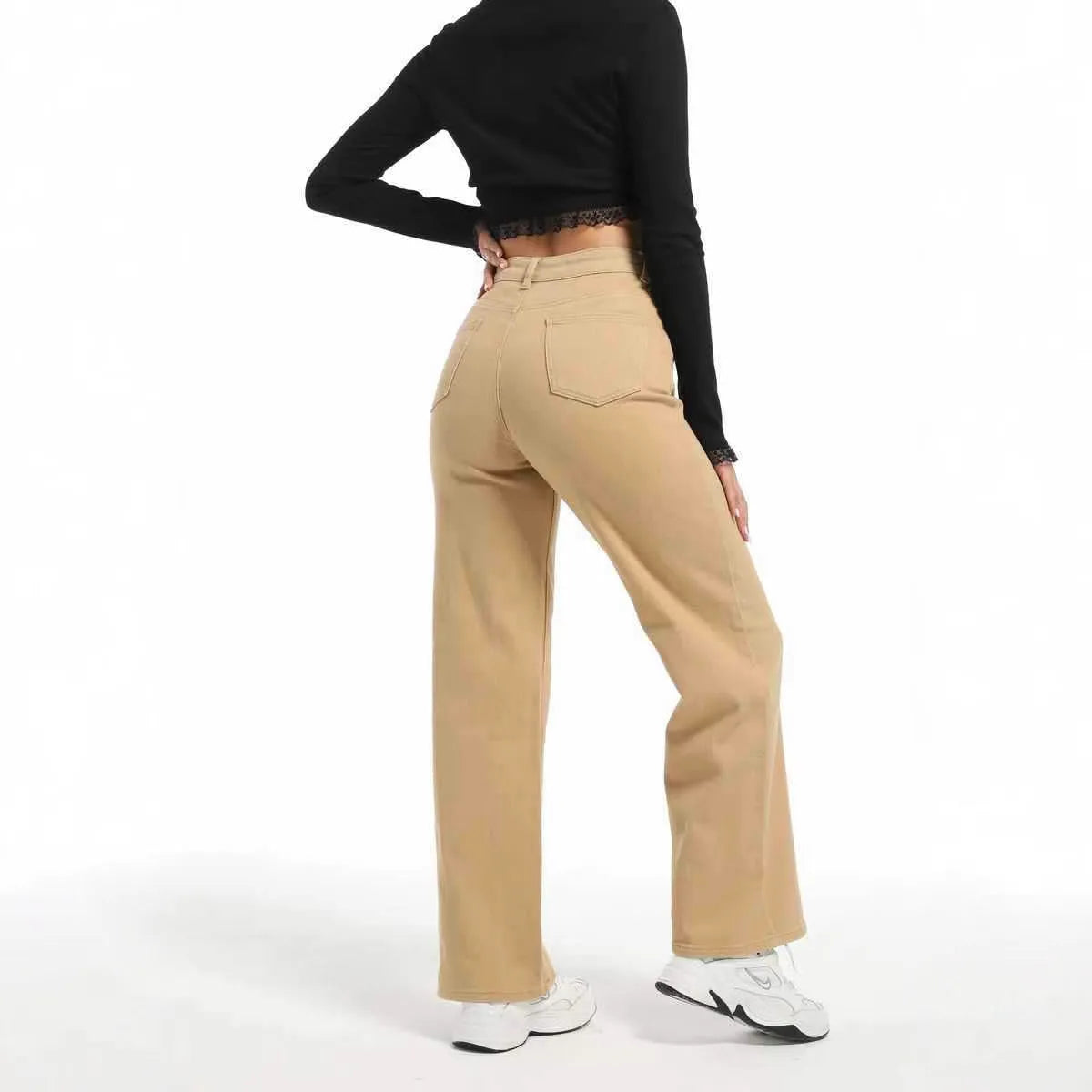 Women's high-waisted straight leg jeans in apricot colour, showing wide leg and elastic cotton fabric.