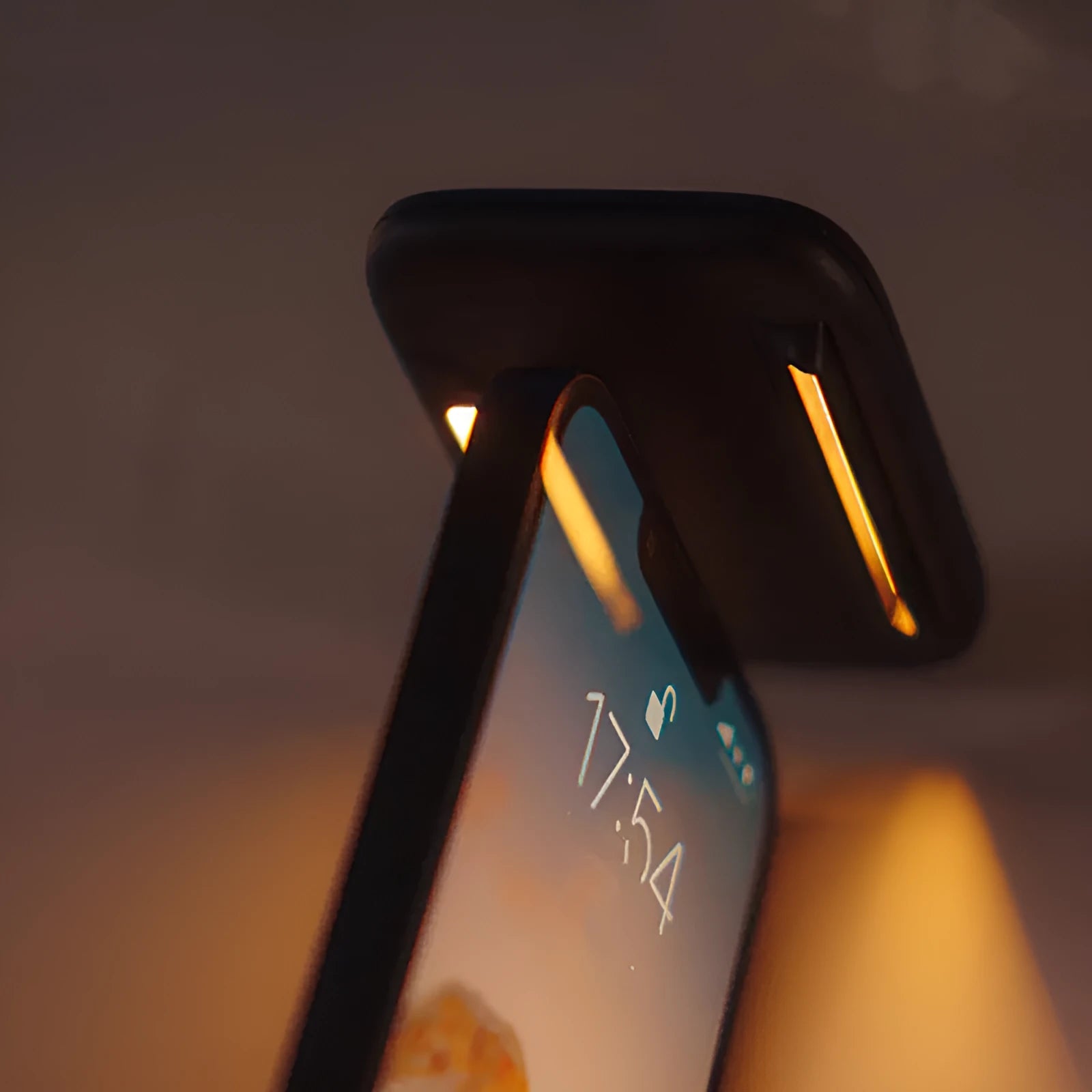 Black MagSafe compatible screen hanging light mounted on tablet showing dimmable reading illumination