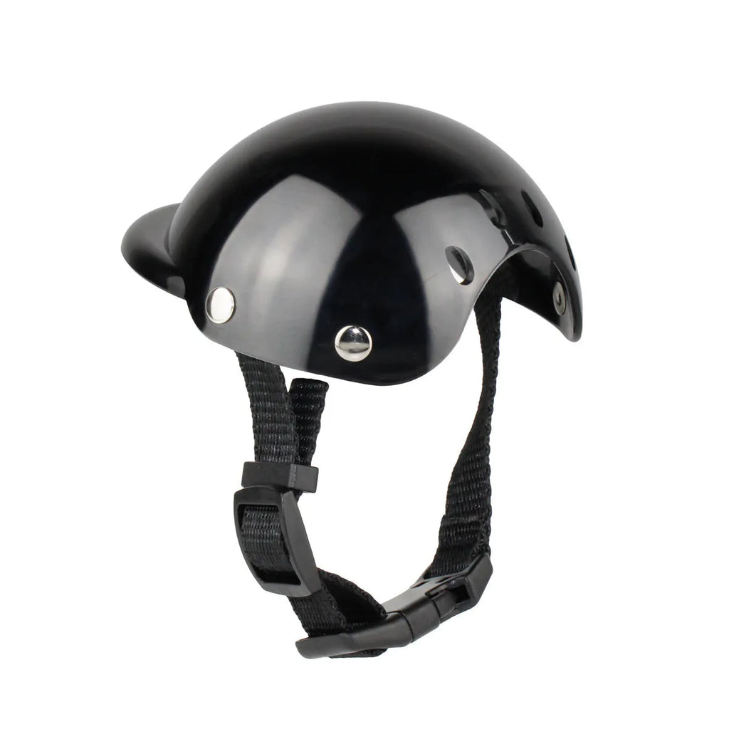Black pet motorcycle helmet for dog or cat with adjustable strap on a bicycle