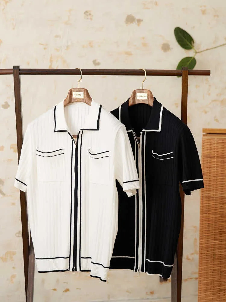 Slim fit black knitting polo shirt with short sleeves and a lapel collar laid flat.