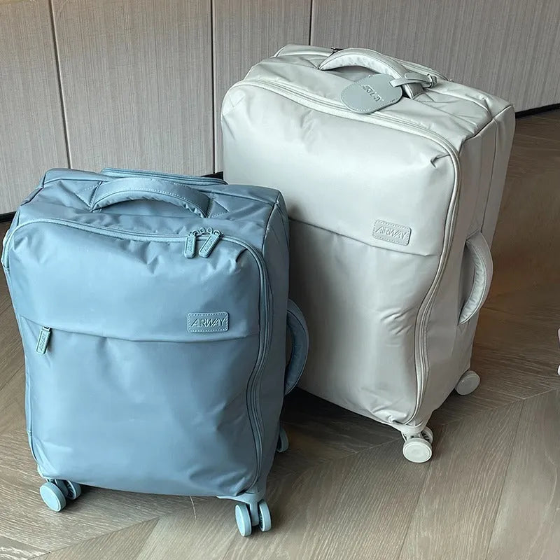 Tea brown coloured ultra-light waterproof Oxford cloth wheeled luggage suitcase in a 20-inch size.