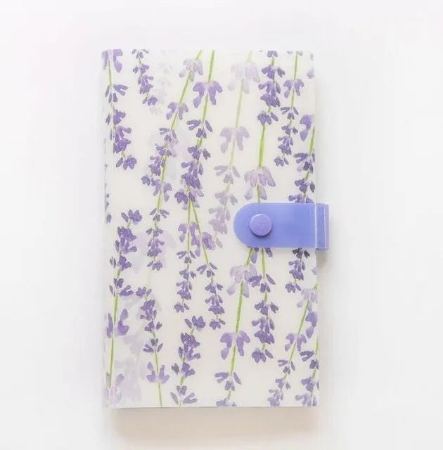 Blue PVC and PP business card holder book with protective shell, showing smile logo and insert slots.
