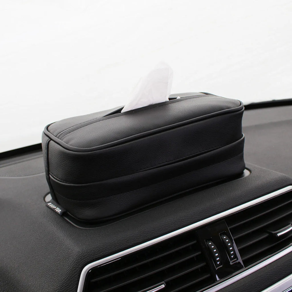 Black leather hanging storage box with strap handles for car and home organisation