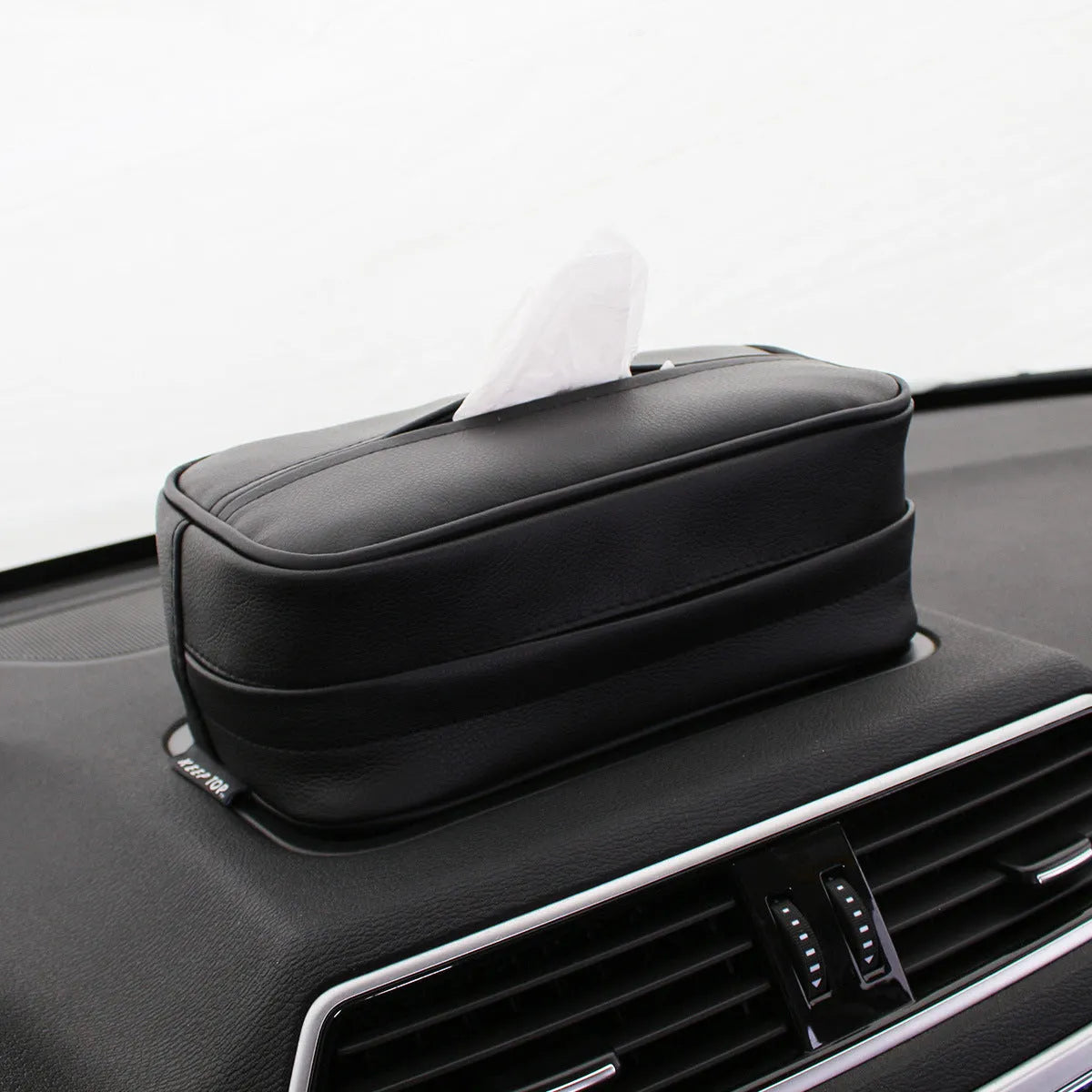 Black leather hanging storage box with strap handles for car and home organisation