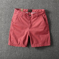Men's loose cotton shorts in straight-leg style showing zipper fly and multiple colour options
