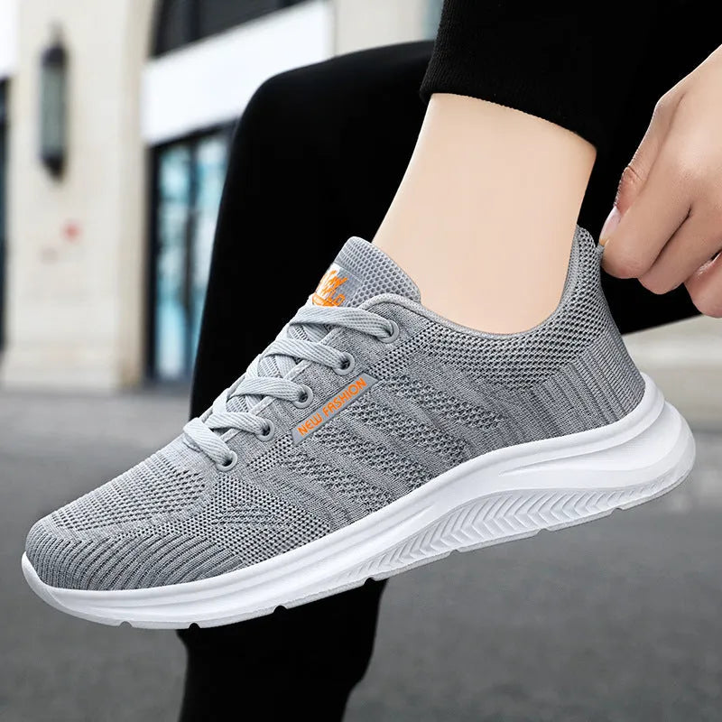 Unisex mesh upper casual trainers in solid colour, available in black, grey, and pink, sizes 36-44