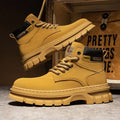 Men's high top Martin boots in YE50 Brown artificial PU leather with lace-up front and round toe on a wooden floor