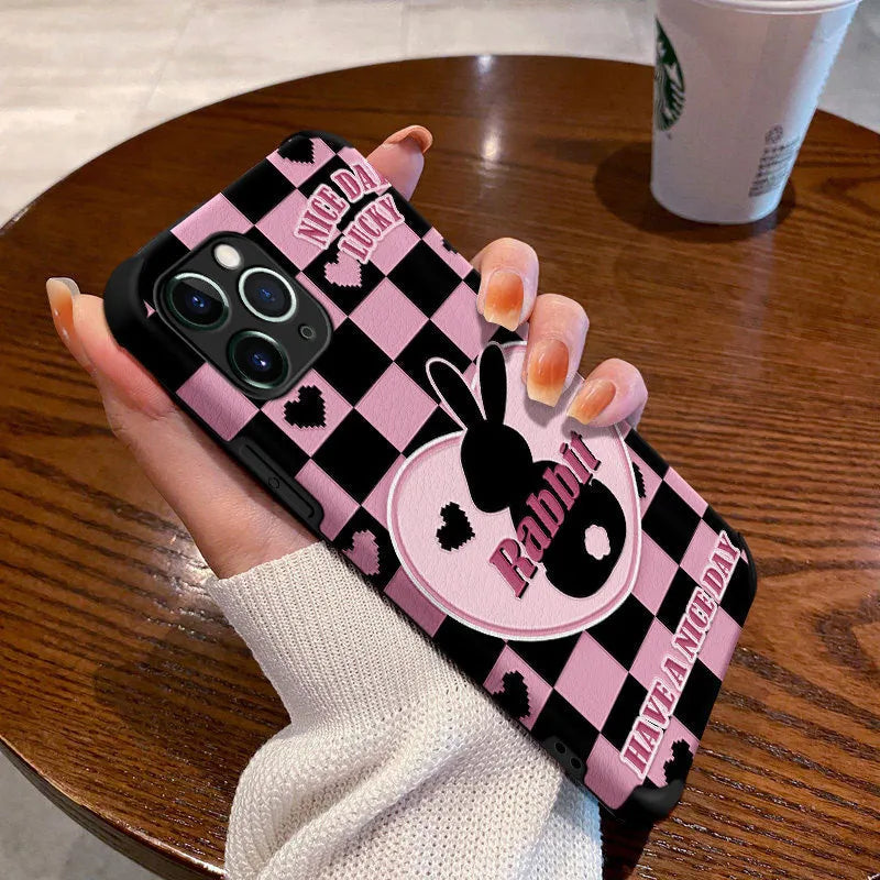 Cartoon creative TPU phone case with checkerboard bunny design on an iPhone 14, in wave black colour