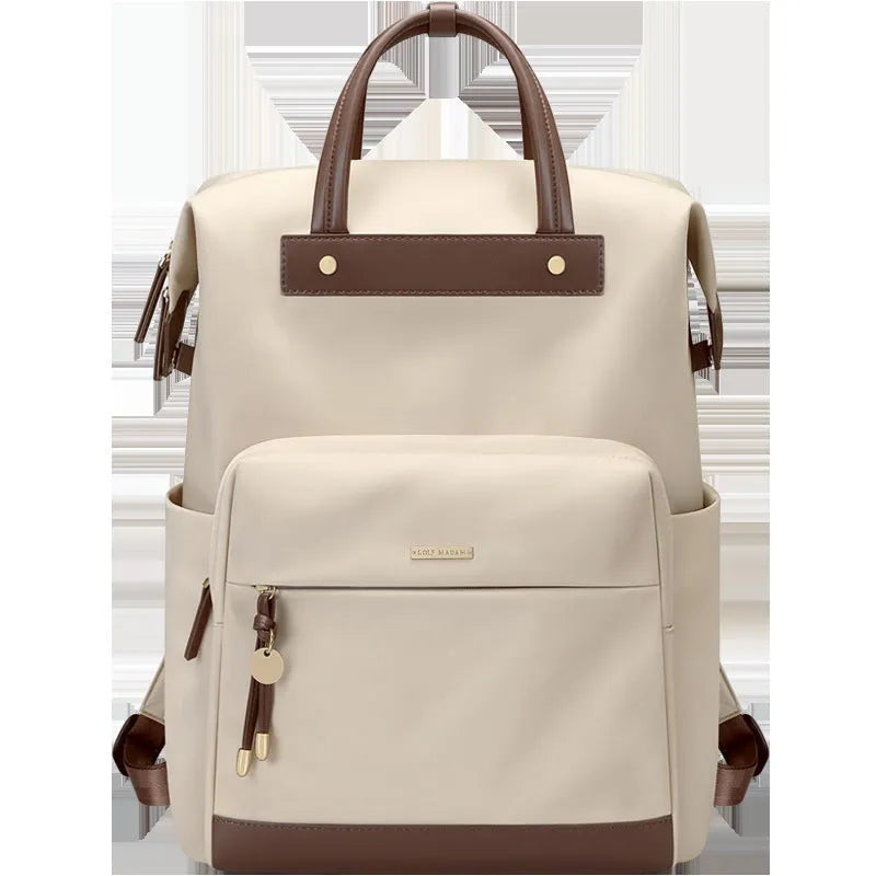 Women's large fabric backpack with synthetic leather trim in apricot colour, showing adjustable straps.