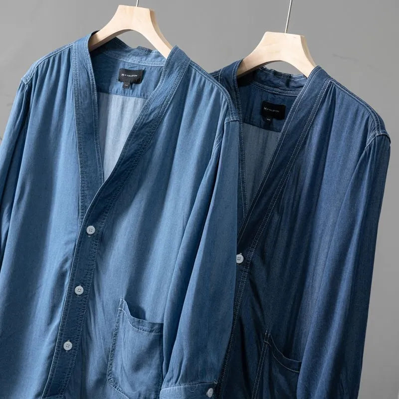 Men's dark blue three-quarter sleeve V-neck casual denim coat laid flat.