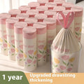 Pink degradable drawstring garbage bags with argy wormwood mosquito repellent, shown in a pack.