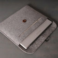 Orange felt laptop bag compatible with MacBook and tablet computers, open to show padded interior