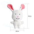 Animal shaped plush squeaky dog chew toy in assorted colours including blue, brown, and cow print.