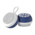 Yellow silicone pet bath brush and grooming comb tool held in a hand.