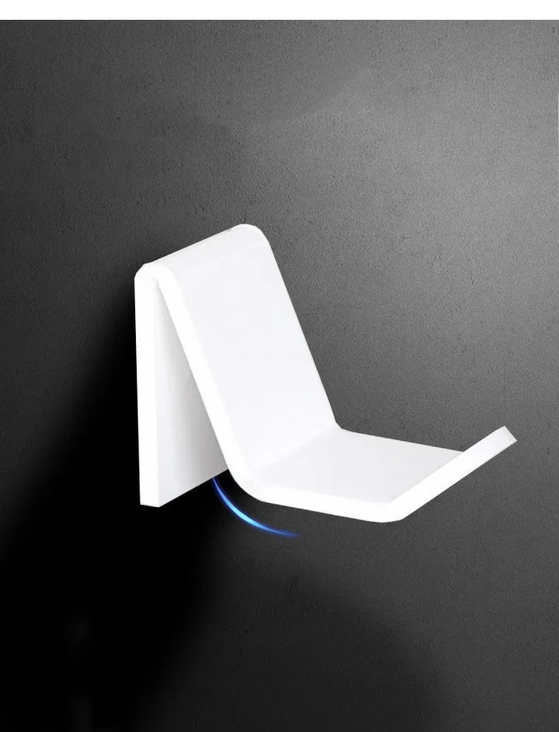 Universal game controller mounting bracket in black colour with nail and adhesive installation options