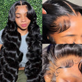 Black medium-long curly synthetic wig with a natural lace front hairline, shown from the side.