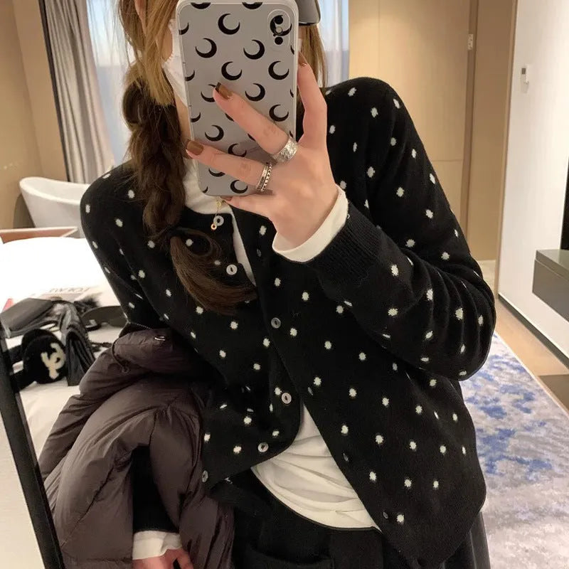 Grey dot crochet pattern on a loose-fit black women's viscose knitted cardigan.