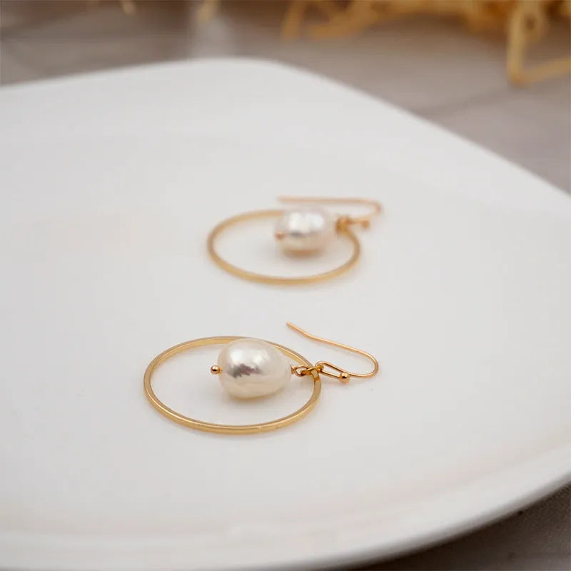 Baroque large circle shaped pearl earrings in simple geometric style for women