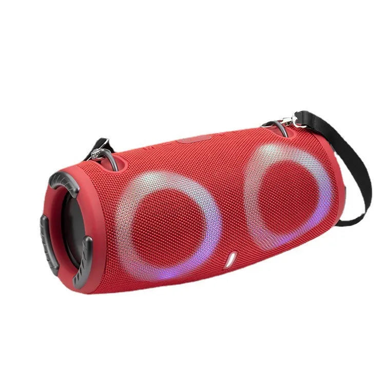 War Drum portable Bluetooth speaker with coloured RGB lights in camouflage colour, showing carrying strap and control buttons.