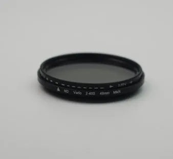 Adjustable camera lens filter mount with a set of four neutral density ND filters for multi-diameter lenses.