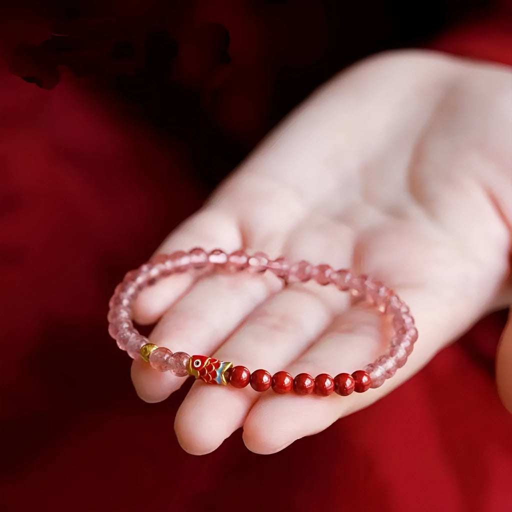 Purple cinnabar and strawberry quartz women's bracelet with lucky koi peach blossom charm