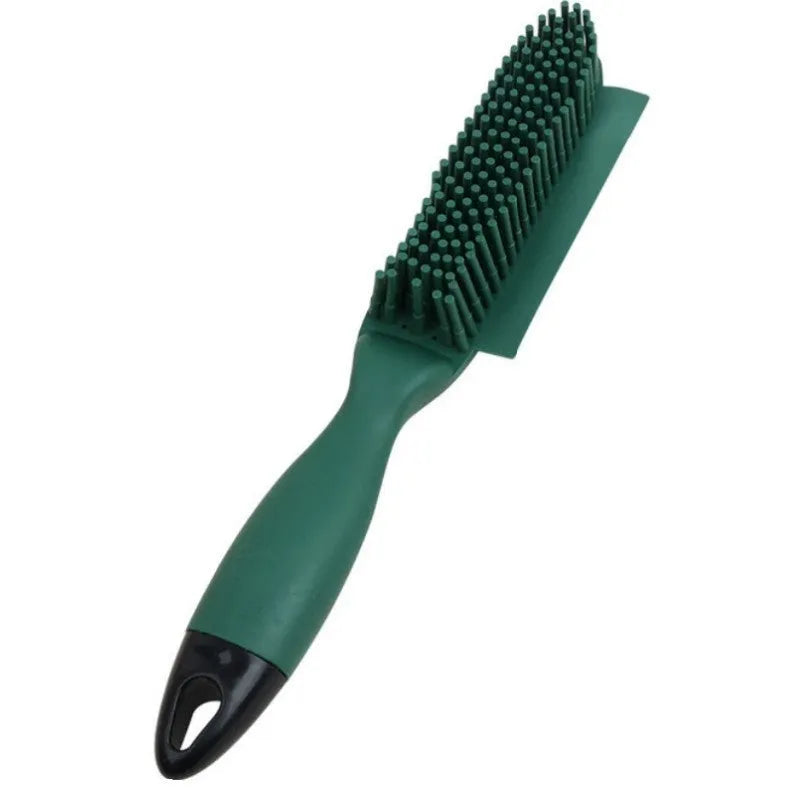 Pink and green handheld pet hair remover brush with grooming comb and integrated clothes hair collector.