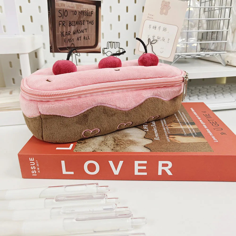 Cherry Cake coloured plush velvet pencil bag with a zip closure.
