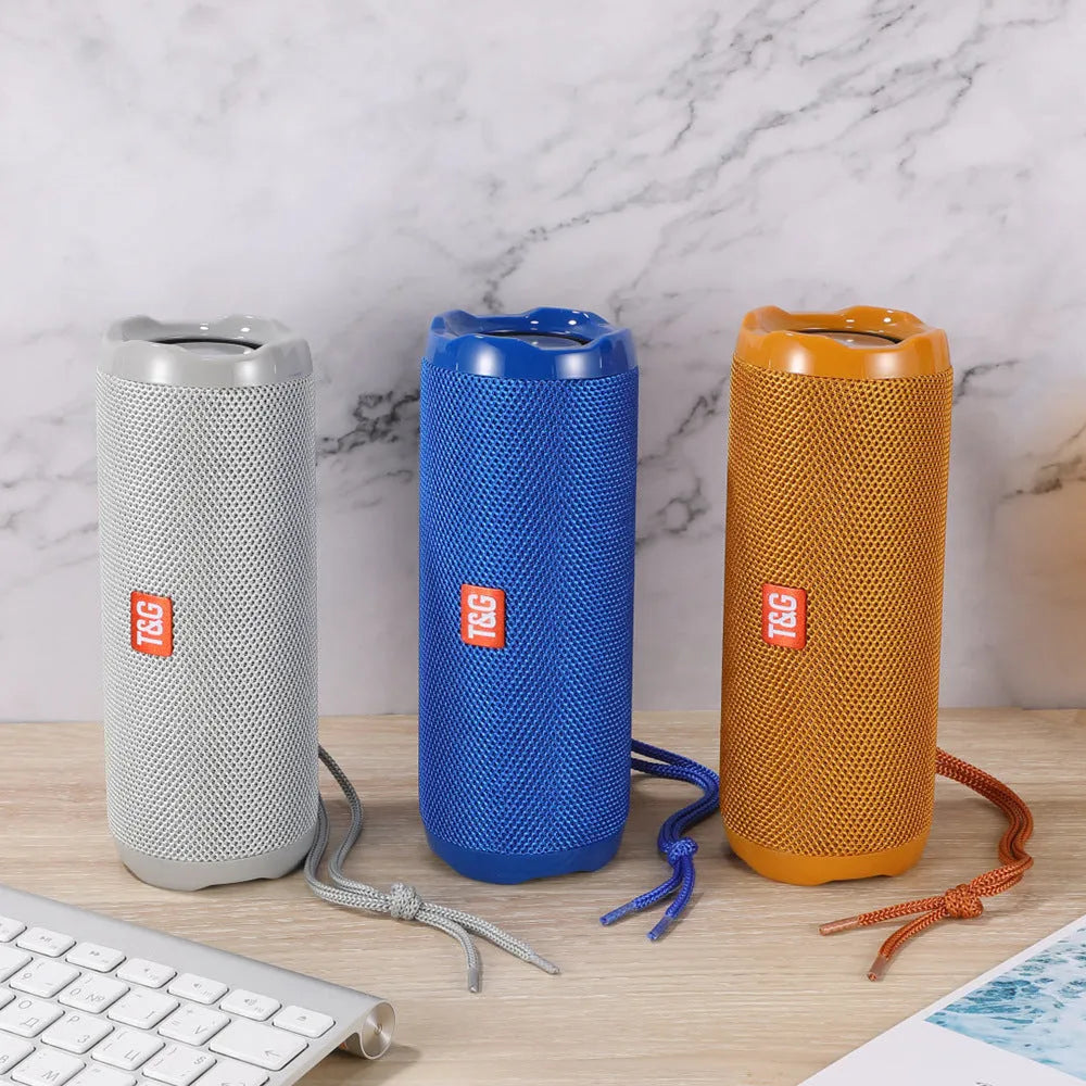 Fabric portable Bluetooth speaker with integrated card slot in multiple colour options.