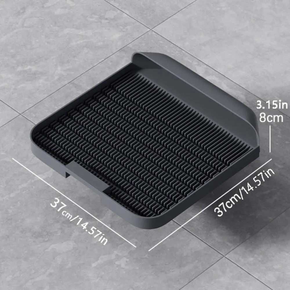 Black cat litter pedal with slanted design and textured grooves for litter containment
