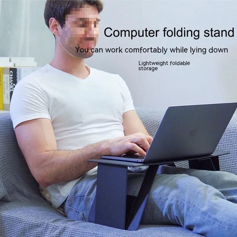Foldable wooden laptop stand in black, raised on a desk with space underneath