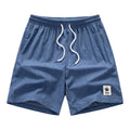 Men's grey drawstring summer shorts with elastic fabric on a mannequin